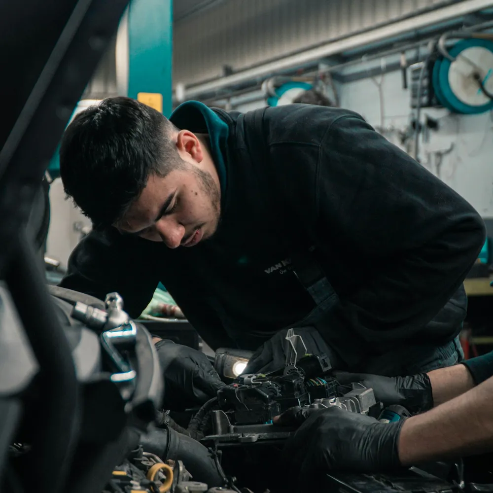 Mechanic working in an engine bay